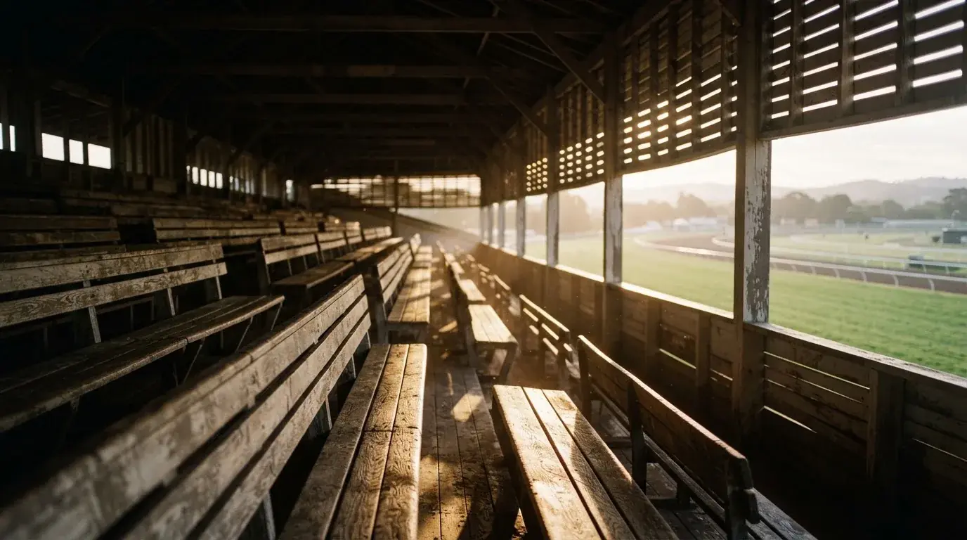 An empty courtroom with wooden benches in morning light
